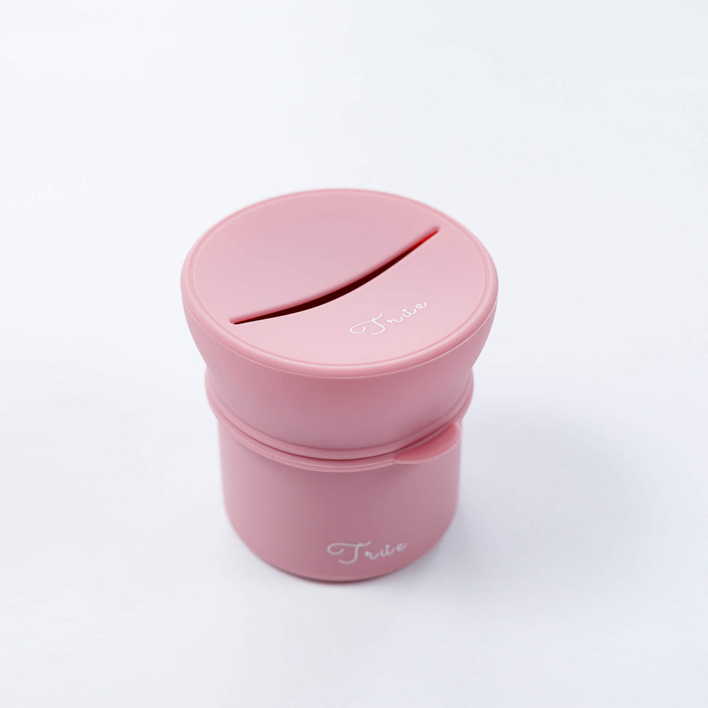 True silicone snack lid with cup in pastel purple color, BPA Free. The lid has a sliced opening in the middle.