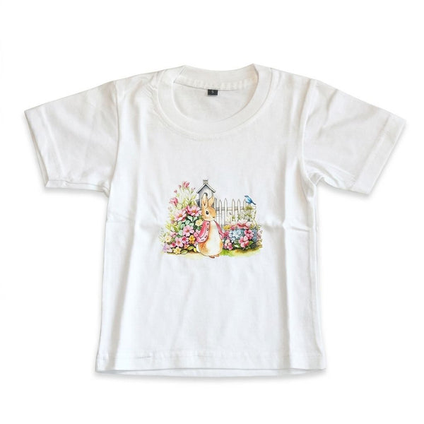 White t-shirt with a printed design of a rabbit and flowers on a white background