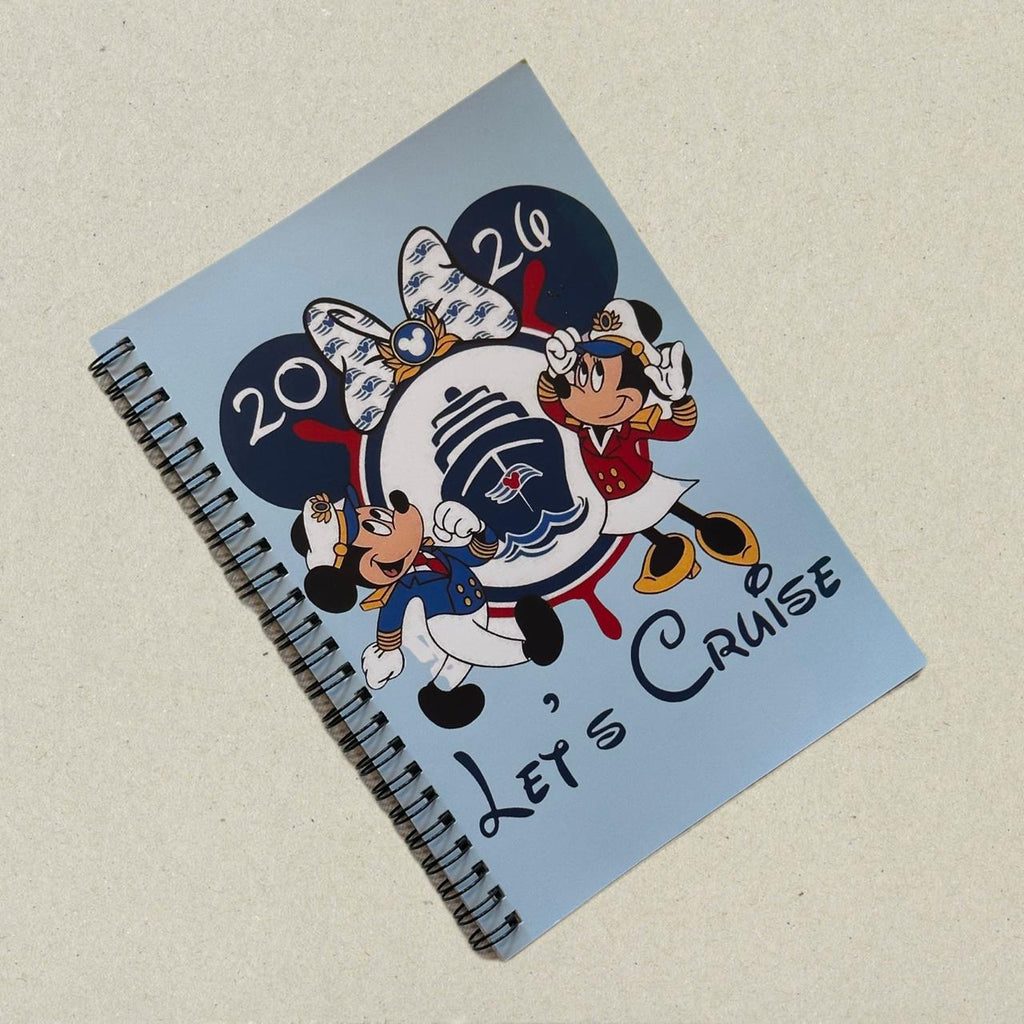 Notebook with cartoon characters and 'Let's Cruise' text on a light blue background
