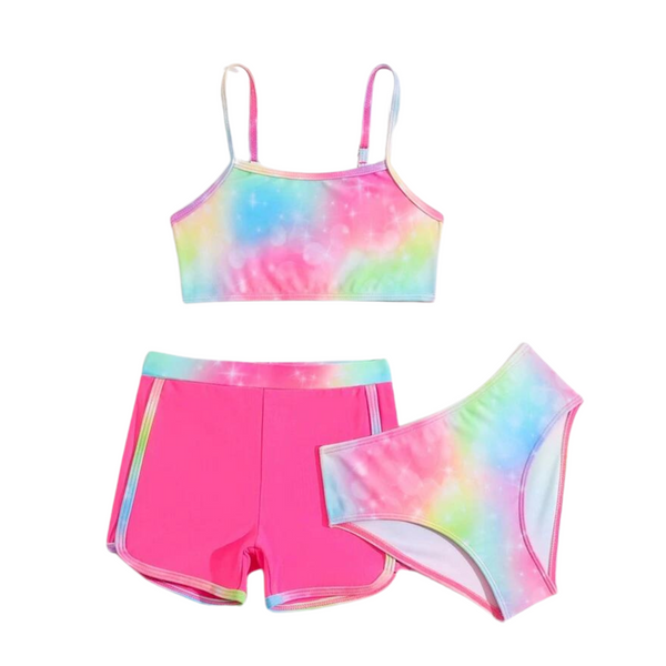 A set of girls' swimwear, featuring a tie-dye pattern with prominent pink color, including a bikini top, swim shorts, and a bottom.