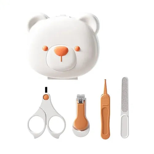 Set of grooming tools including scissors, nail clipper, and others, with a bear-shaped container on a white background.