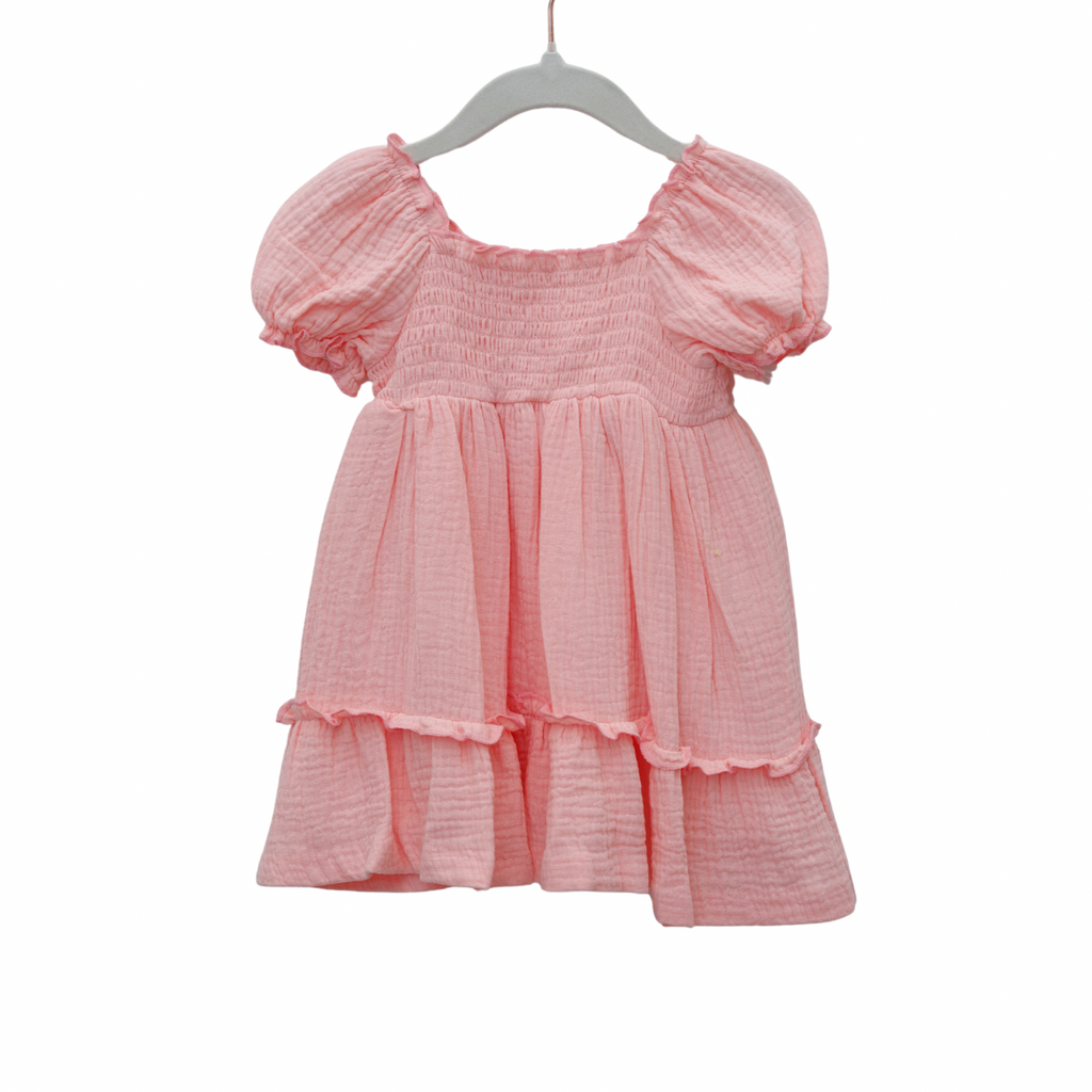 Pink dress with puff sleeves on a white background