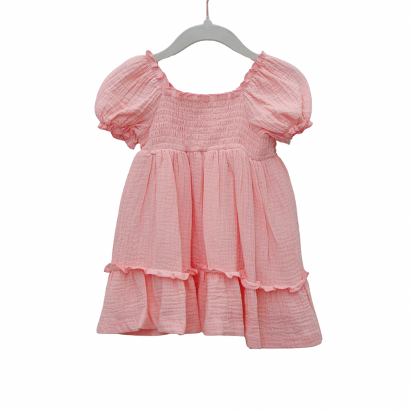 Pink dress with puff sleeves on a white background