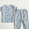 Children's pajama set with bear pattern on a light blue background
