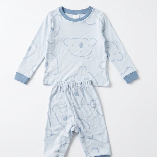 Children's pajama set with bear pattern on a white background