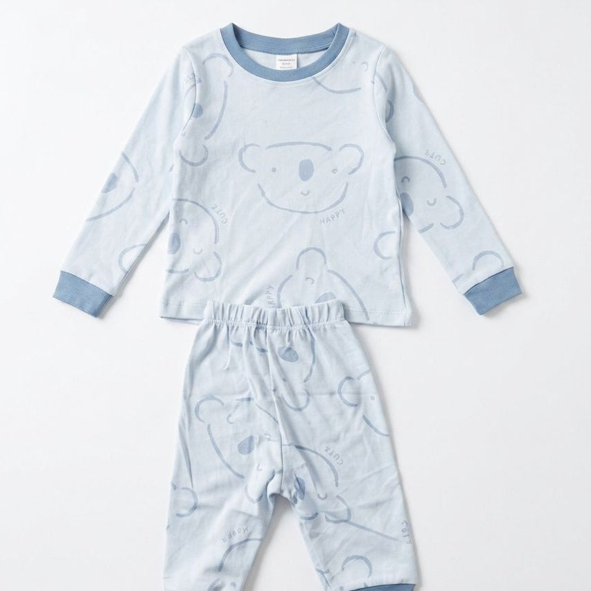 Children's pajama set with bear pattern on a white background