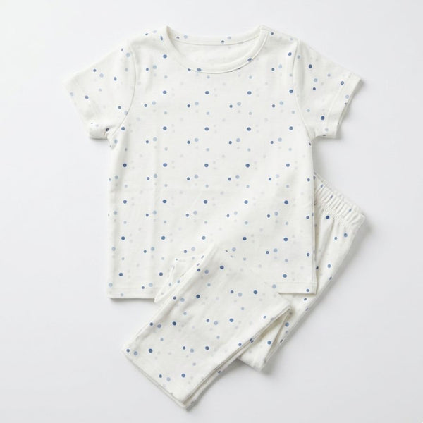 Children's pajama set with short-sleeve top and pants on a light gray background