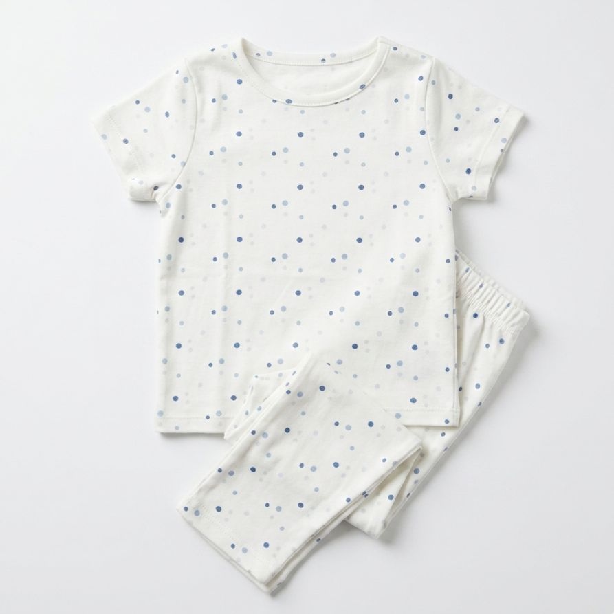 Children's pajama set with short-sleeve top and pants on a light gray background