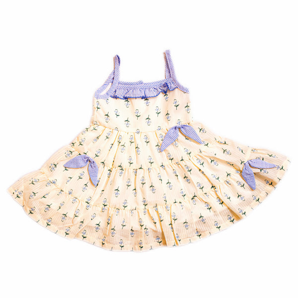 Yellow dress with blue accents on a white background