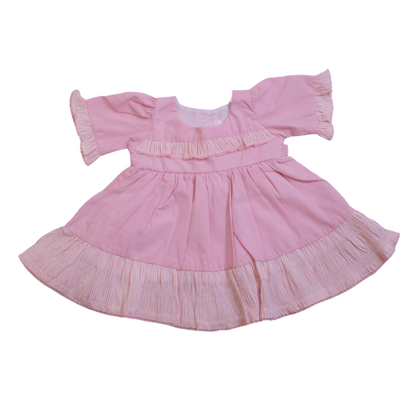 Pink dress with ruffled sleeves and hem on a white background