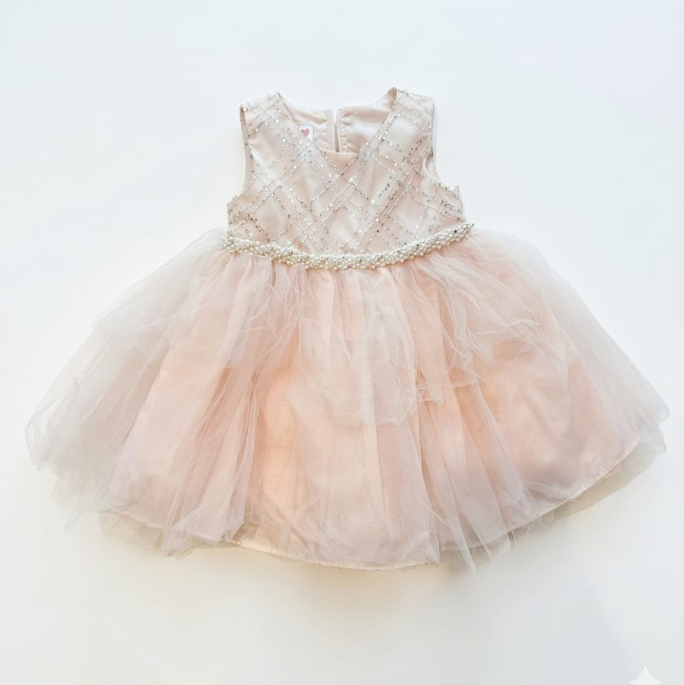 Pink dress with lace top and tulle skirt on a white background