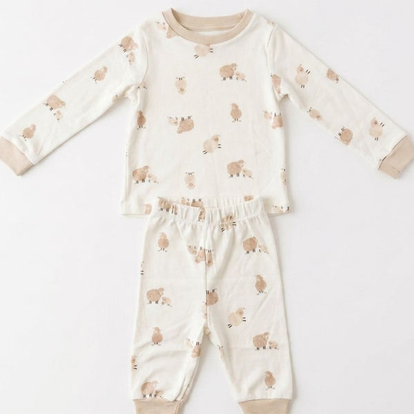 Children's pajama set with animal pattern on a white background