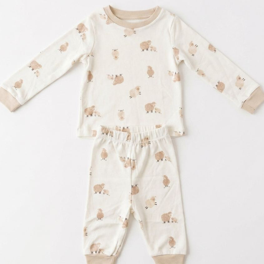 Children's pajama set with animal pattern on a white background