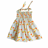 Baby girl floral smocked dress with orange and yellow details on a white background
