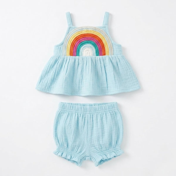 Light blue children's top and shorts set with a rainbow design on a white background