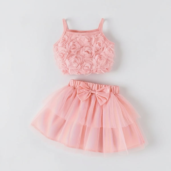 Pink floral top and skirt set on a light gray background