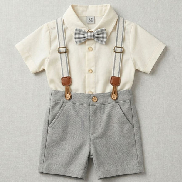 Children's outfit with shirt, suspenders, and bow tie on a light gray background