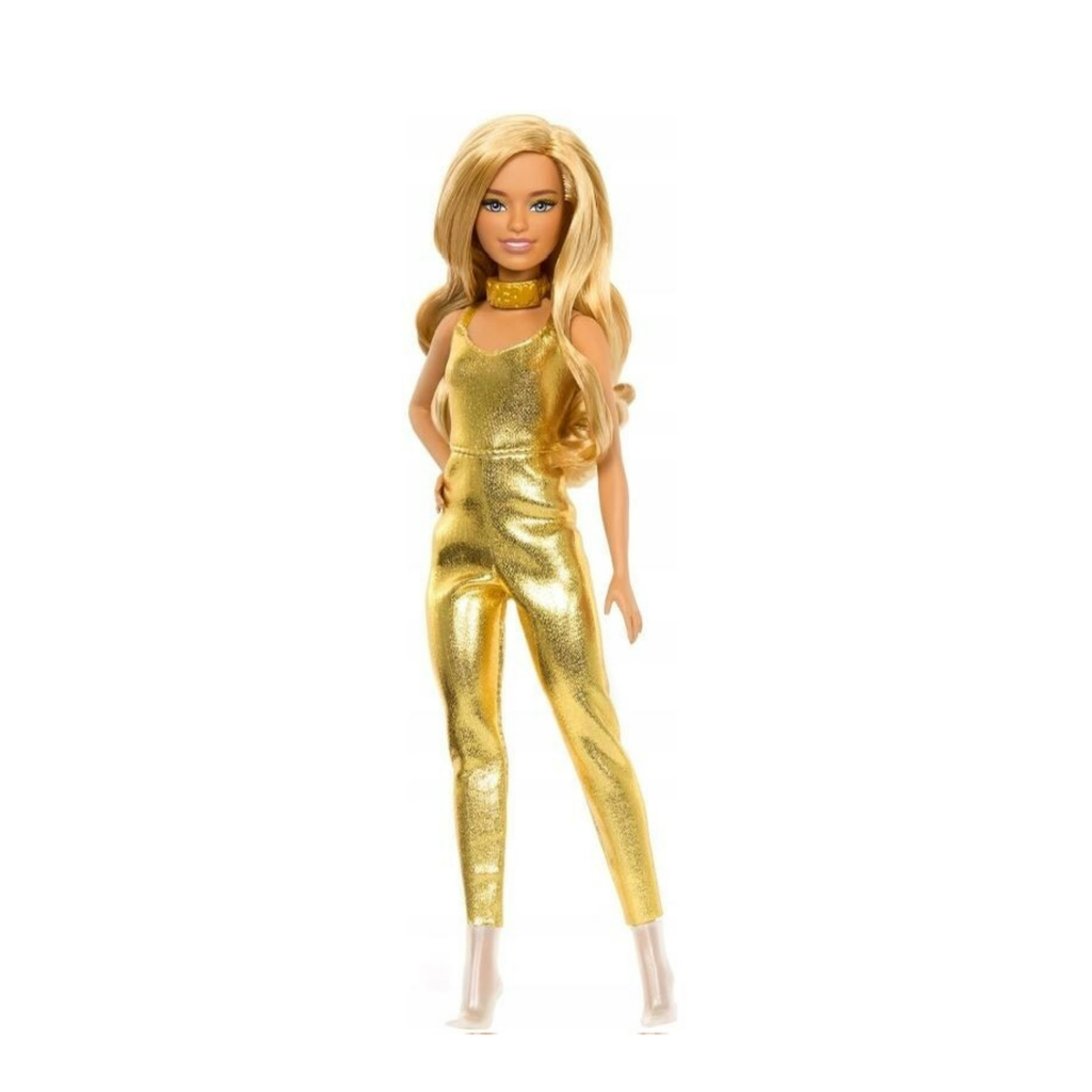 A blonde fashion doll wearing a shiny metallic gold jumpsuit with a matching gold choker, standing against a plain white background.