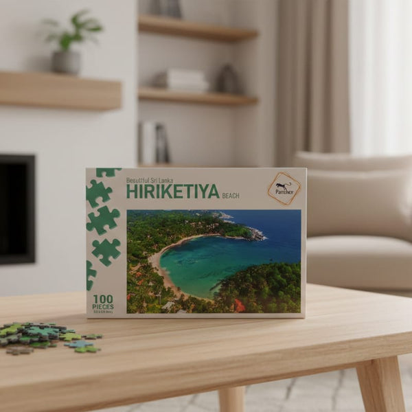Puzzle box with a scenic design on a wooden table in a living room.