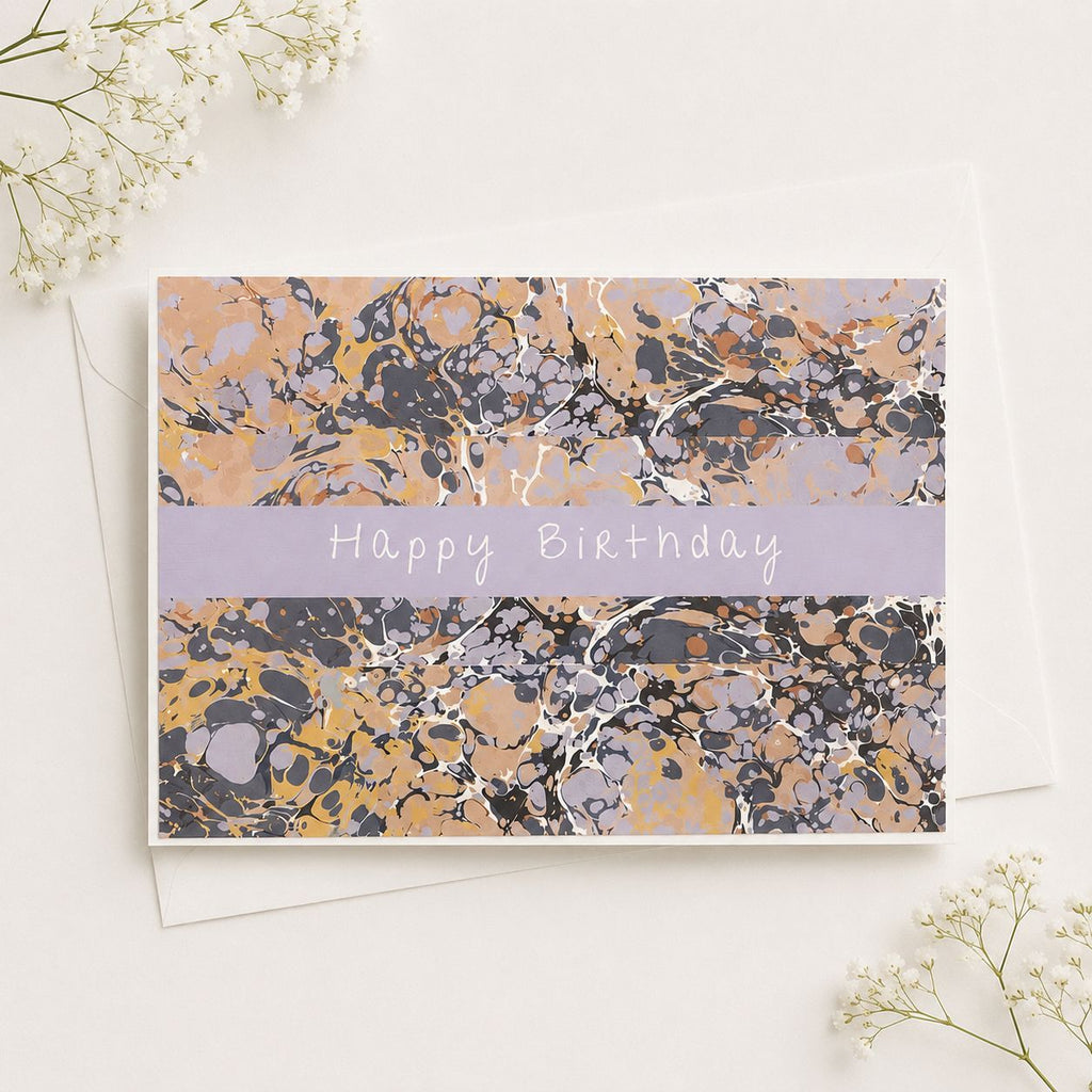 Marbled birthday card with 'Happy Birthday' text on a white background