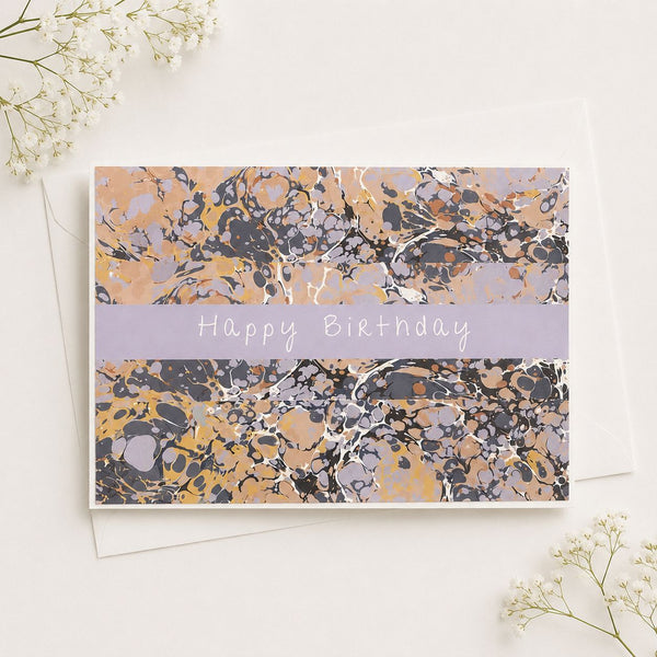 Marbled birthday card with 'Happy Birthday' text on a white background