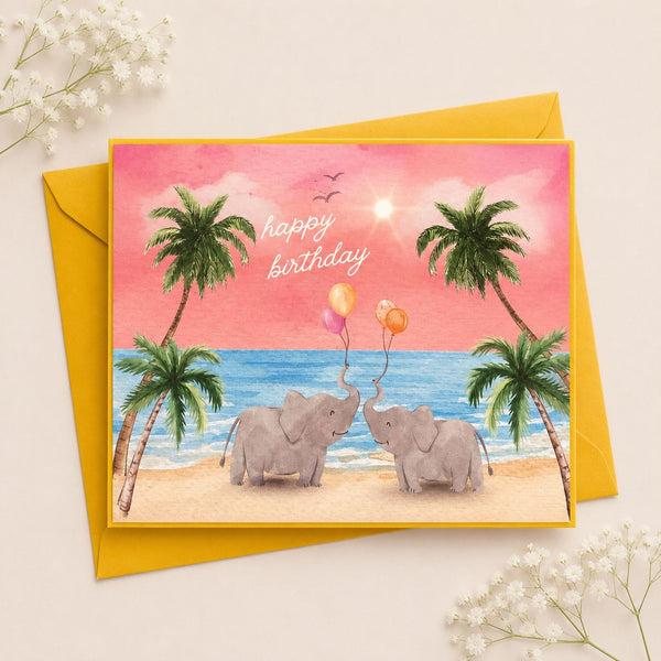 Birthday card with elephants and balloons on a beach scene, featuring a yellow envelope.