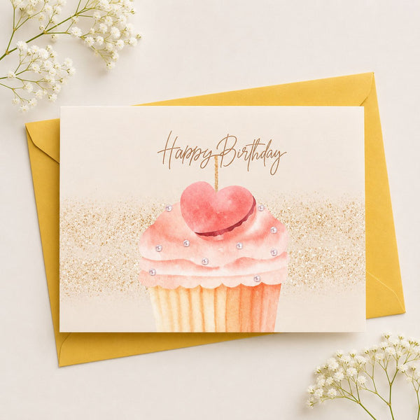 Birthday card with pink cupcake illustration and 'Happy Birthday' text, featuring a yellow envelope.