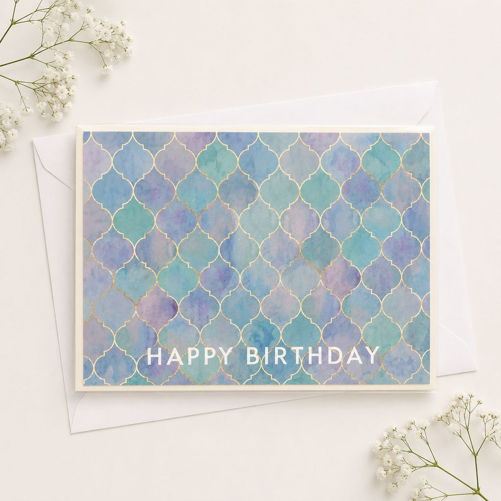 Birthday card with blue and purple pattern and 'Happy Birthday' text on a white background