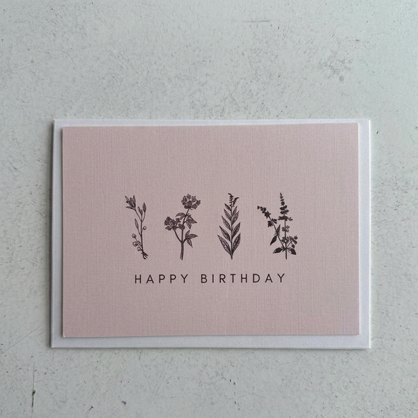 Pink birthday card with floral illustrations and 'Happy Birthday' text on a textured gray background