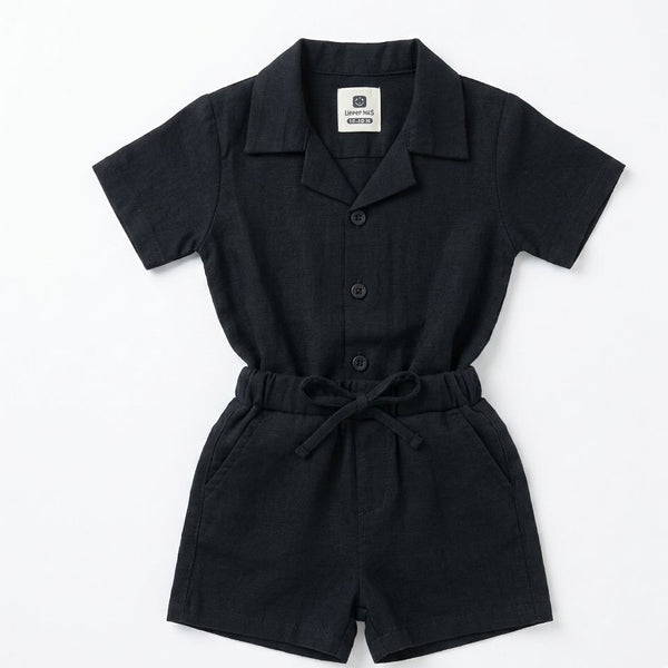 Black romper with collar and buttons on a white background