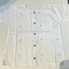 Light blue embroidered shirt on a white background