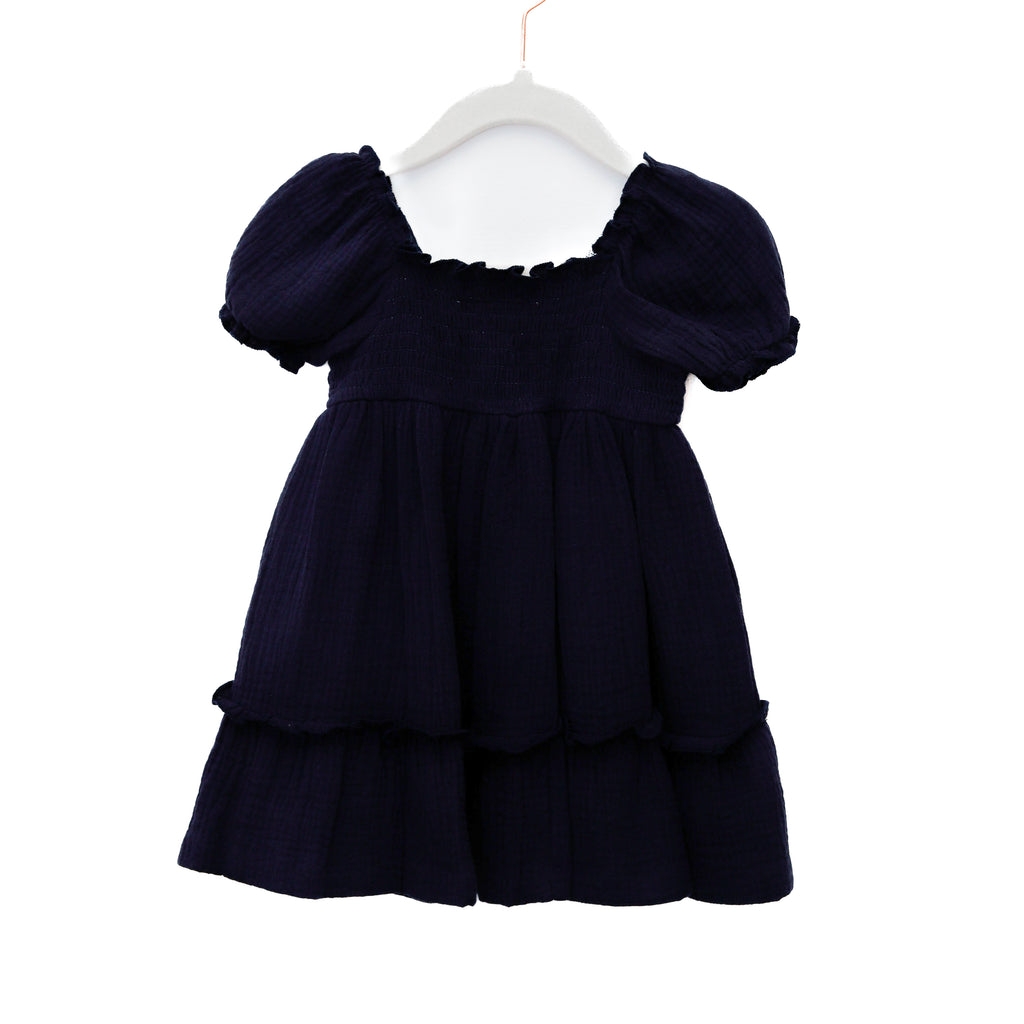 Navy blue dress with puff sleeves on a white hanger