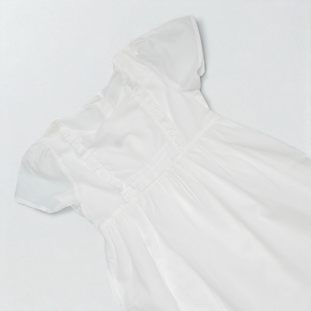 White sleeveless top on a light gray background