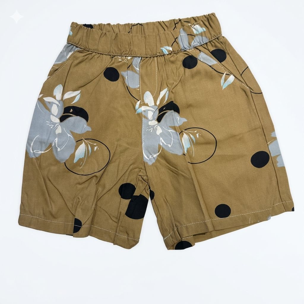 Beige shorts with floral and polka dot patterns on a white background