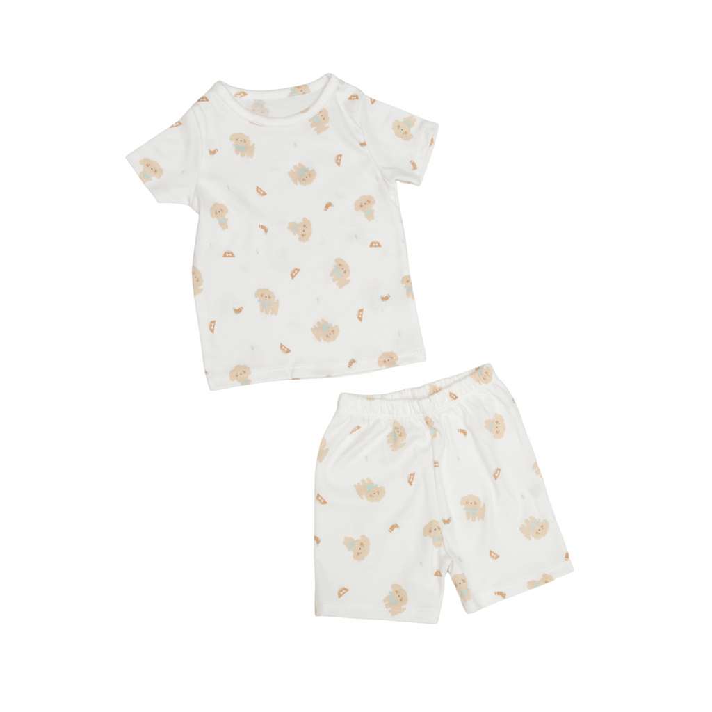 Children's outfit with patterned t-shirt and shorts on a white background
