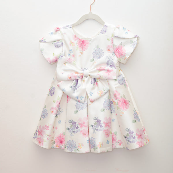 Floral dress with a large bow on a white background