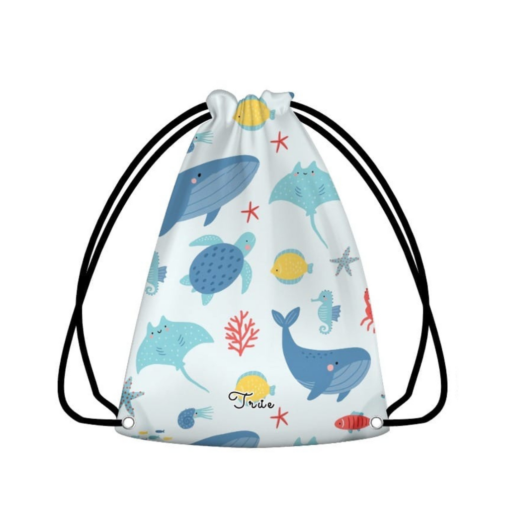 Drawstring bag with ocean-themed design featuring whales, turtles, and fish on a white background.