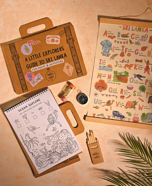 Educational kit for children with a notebook, coloring book, and pencils on a beige background