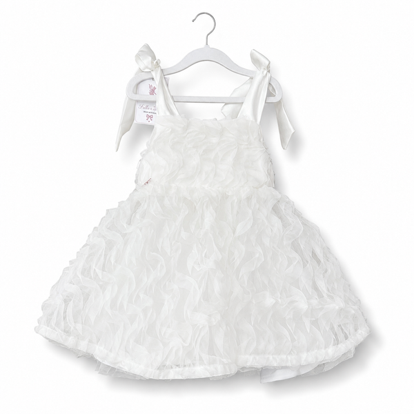 White dress with ruffled details on a white background