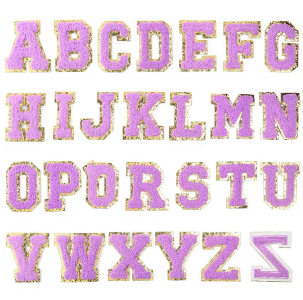 A set of embroidery fabric letter patches in purple, with each letter in the alphabet having a purple patch with the corresponding letter.