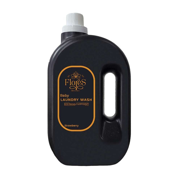 A black bottle of Flores Eco Baby Laundry Wash with a white cap and a label that has the product name and 'Strawberry' written on it.