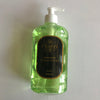 A 500ml clear pump bottle of Flores Eco handwash with a greenish tint and a label that includes the brand name and product description.