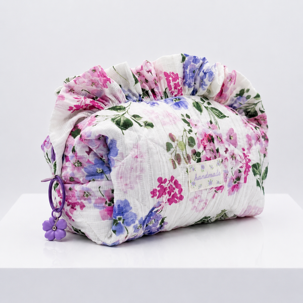 Floral-patterned fabric Makeup pouch on a white background