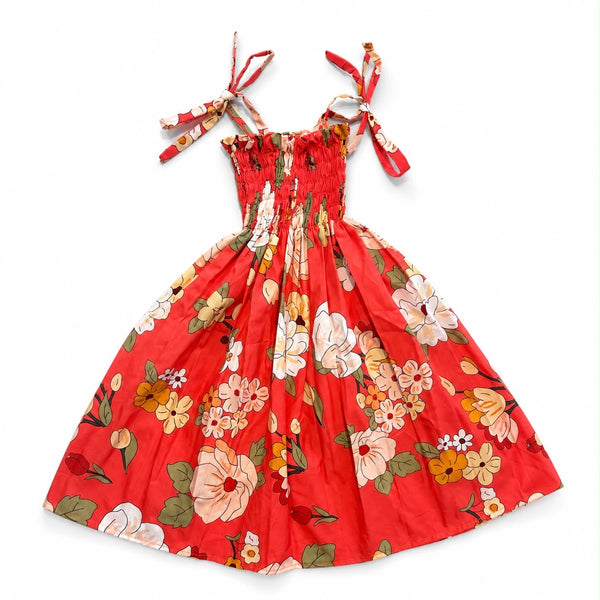 Floral Smocked Sundress in Vibrant Red on White Background taken with studio shot effect