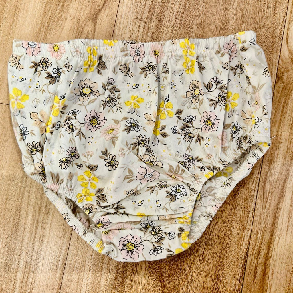 Floral-patterned fabric on a wooden surface