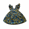 Floral dress with blue flowers on a green background