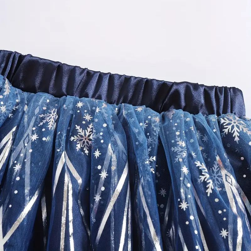 Blue tulle skirt with snowflake pattern on a white background
