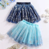 Two tutu skirts, one blue and one navy, with snowflake patterns on a white background.