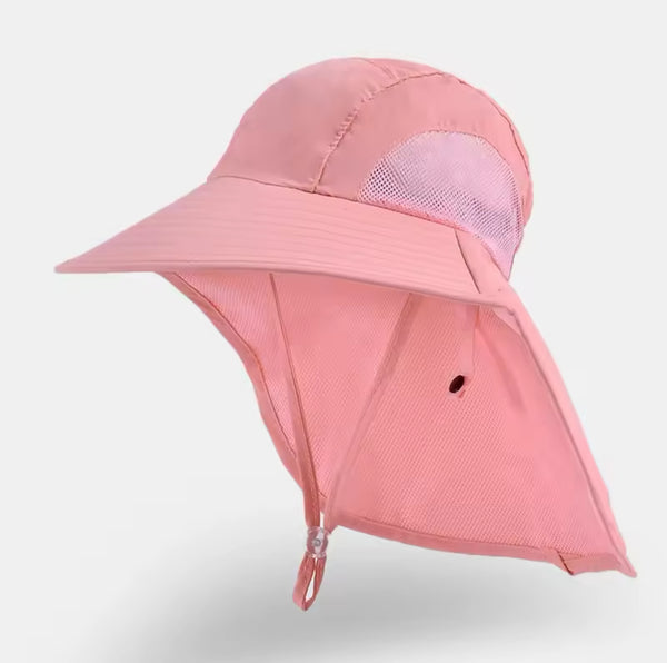 Introducing the Kids UV Protect Sun Caps in light pink by True. This wide-brimmed hat, designed specifically for children, includes an extended neck flap for enhanced sun protection. It features mesh panels on the sides to ensure ventilation and comes with an adjustable chin strap for a secure fit. The cap is made from breathable and lightweight material, making it ideal for your child's outdoor activities.