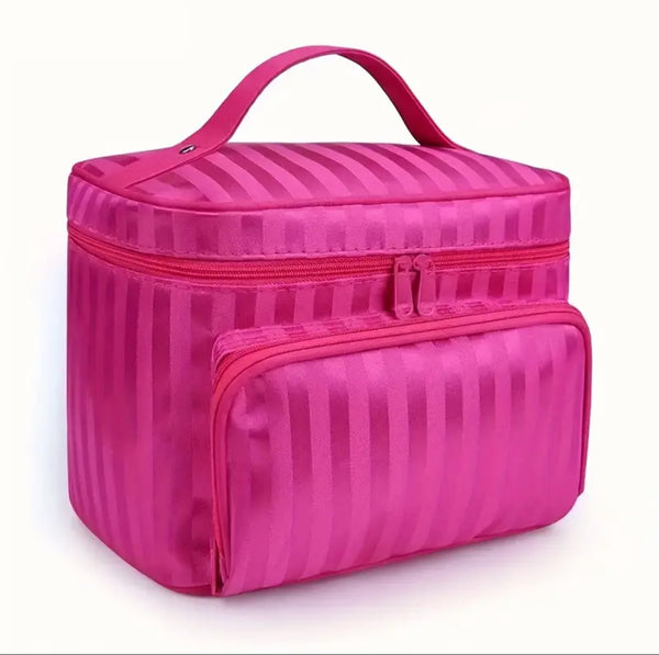 Pink striped cosmetic bag on a white background